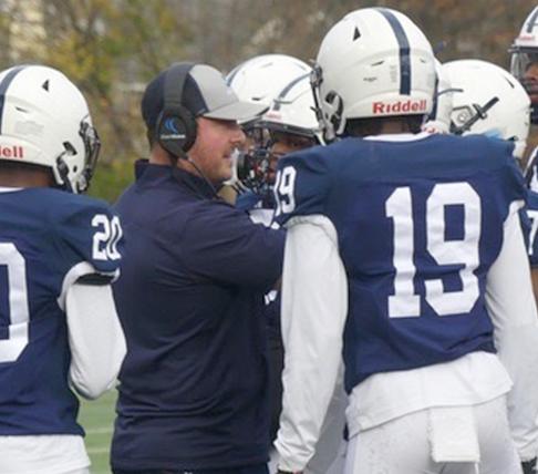 Robertson Hired as New Football Coach
