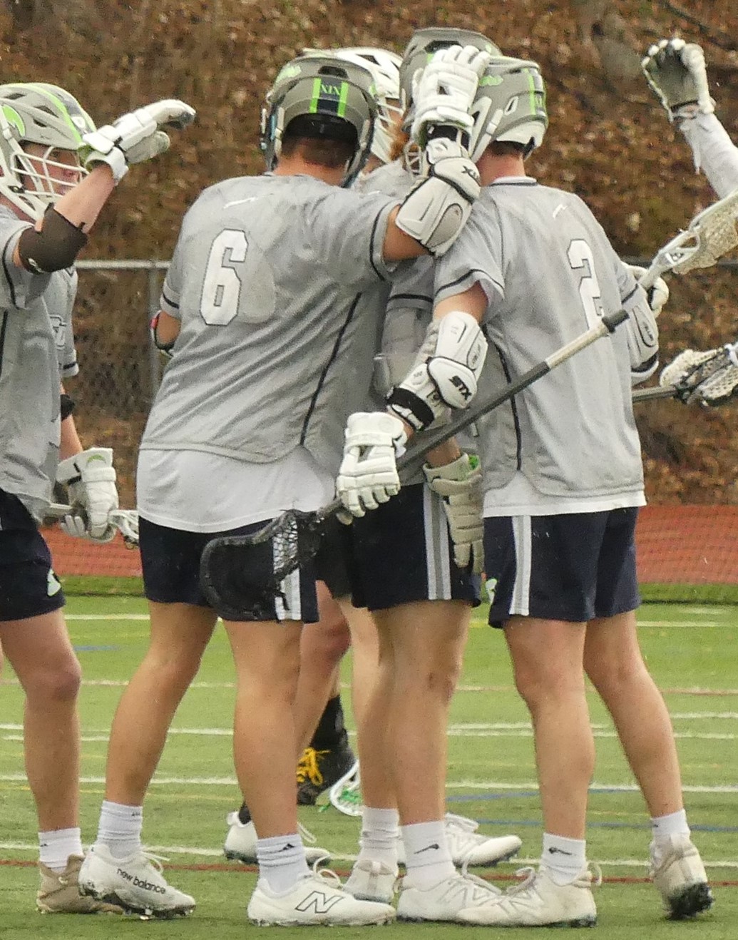 Jeremiah Carfello celebrates one of his school record nine goals with his teammates